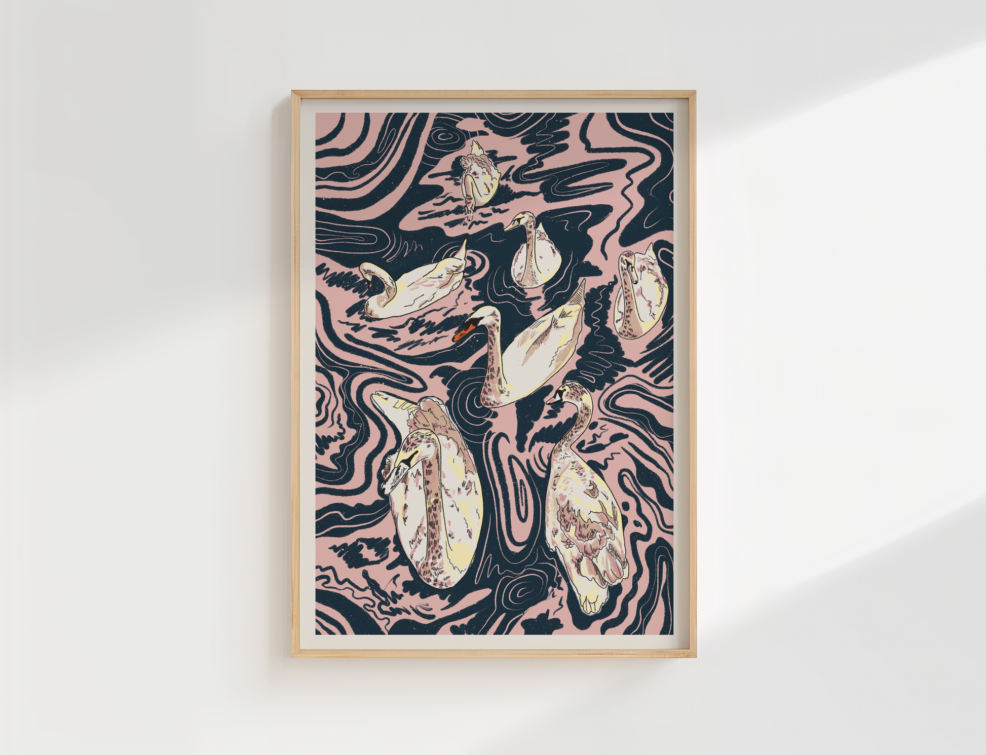 Framed artwork with swan design on a white wall