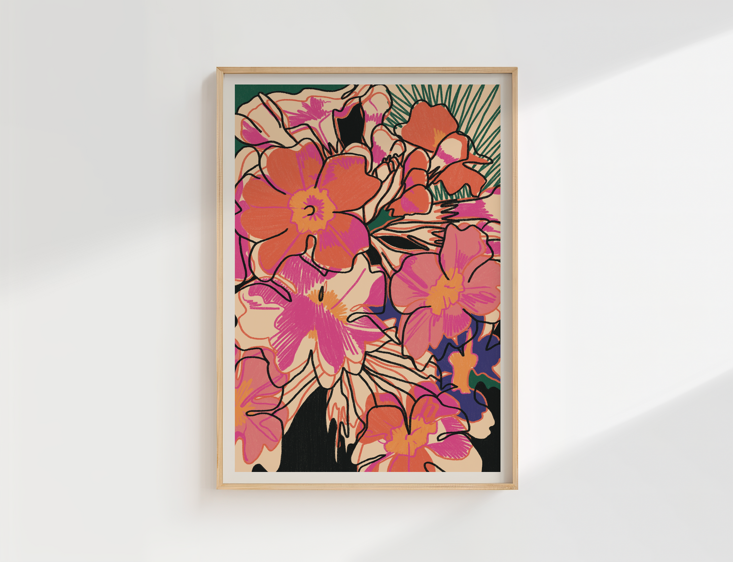 Framed colourful floral artwork on a white wall